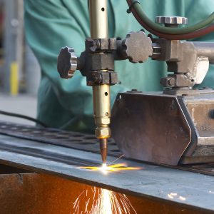 Close-up of cutting torch in action with sparks